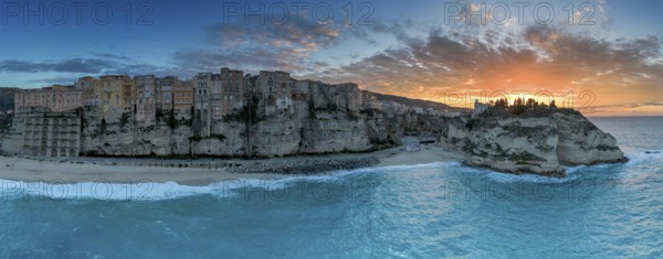 Tropea, Italy, 16 December, 2023: panorama view of Rotonda Beach and the colourful old town of Tropea in Calabria at sunset, Europe