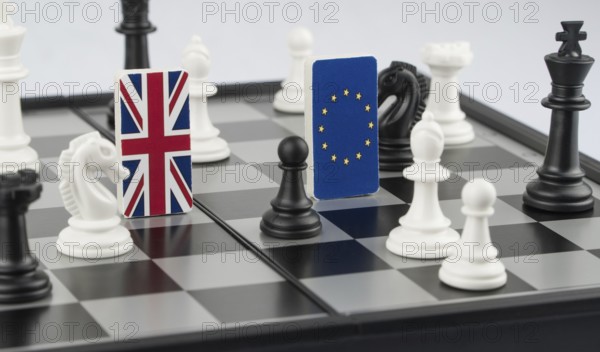 Chess pieces and flags of the European Union and the Britain on a chessboard. The concept of the political game and chess strategy Brexit