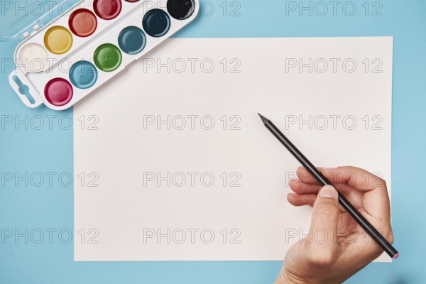 Top view of paint and brush. school table top view. arts class.