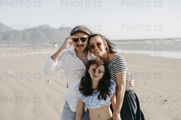 Family on the sandy beach in Sommerset West, Cape Town, South Africa, Africa