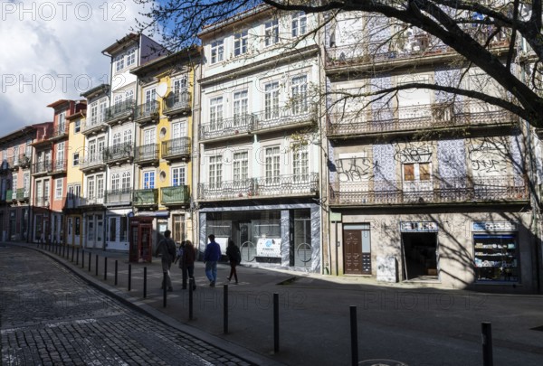 Street scene, passers-by in front of historic house facades in the historic centre, city of Porto, Portugal, Europe