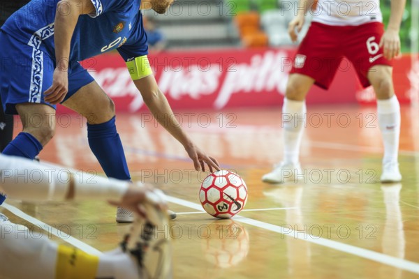 LUBIN, POLAND - MARCH 12, 2025: Futsal match European Championship qualifiers Poland - Moldova 3:0. Detail of futsal ball and player out of field