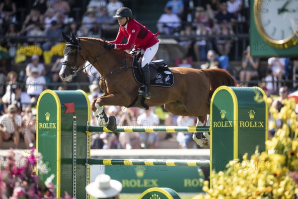 Erynn Ballard of Canada and riding De Flor 111 Z Santa Rosa compete in the first round of the 1.60m CPKC International during the Spruce Meadows Masters, presented by Rolex, in Calgary, Alberta, Canada, North America