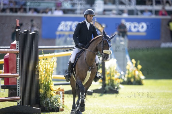 Sameh El Dahabn of Great Britain and riding WKD Toronto compete in the first round of the 1.60m CPKC International during the Spruce Meadows Masters, presented by Rolex, in Calgary, Alberta, Canada, North America