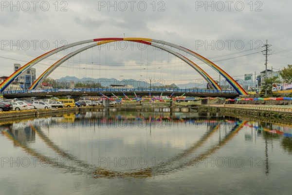 Youngdong County, South Korea. April 25, 2019: Paper lanterns hanging from double arch bridge over river in preparation for Buddha's birthday festivities