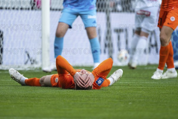 LUBIN, POLAND - MARCH 31, 2025: Football match between KGHM Zaglebie Lubin vs Rakow Czestochowa. Players keeps his head after the howler