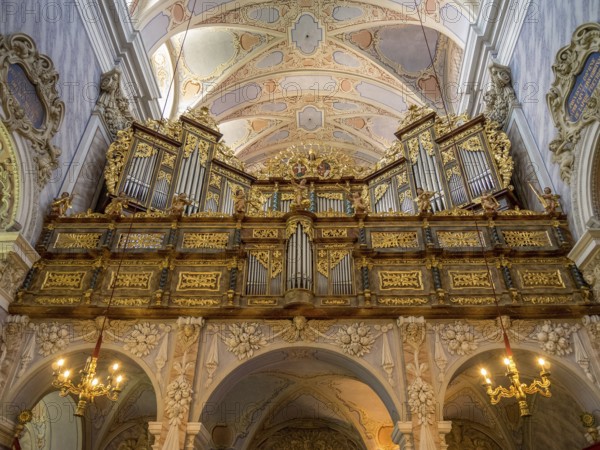 Lavishly decorated organ in a baroque church with detailed ceiling decorations and majestic architecture, Dürnstein, Wachau, Danube, Austria, Europe
