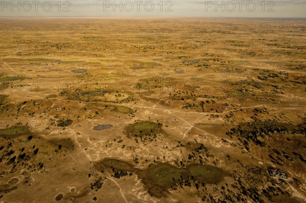 Bushes, gravel roads, sky, waterholes, Kavango Region, Namibia, Africa