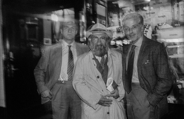 Germany, Berlin, 17 October 1991, Reinald Nohal, artist, author (left), Michel Würthle (right), owner of the Paris Bar in Kantstraße, with a guest, Europe