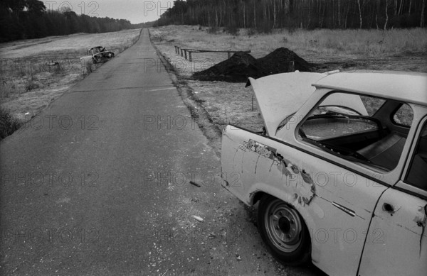 Germany, Berlin, 18.12.1991, access road to the exclave Steinstücken, former wall strip, destroyed Trabant, Europe