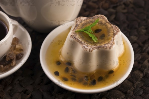 Panna cotta dessert with passion fruit and mint