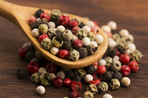 Mixed green, red, white and black peppercorns