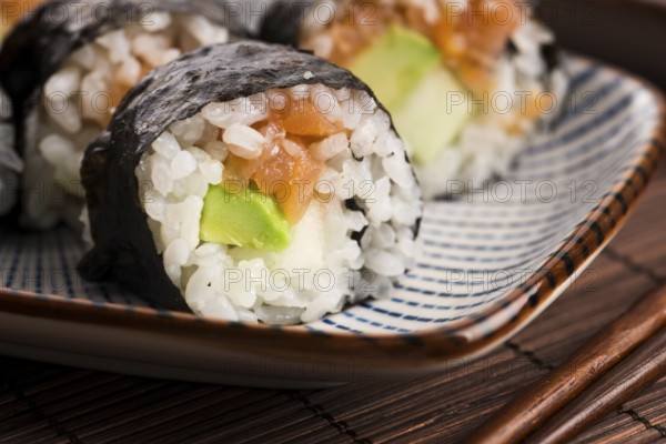 Sushi - Salmon rolls served on a plate