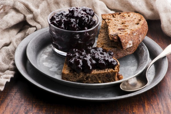 Bread with blueberry jam on the plate