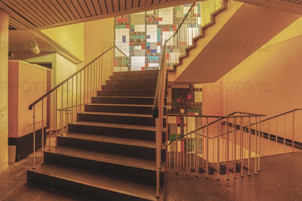 Stairwell with coloured tiles and warm light, Bad am Südpark, Essen-Kray, North Rhine-Westphalia, Germany, Europe