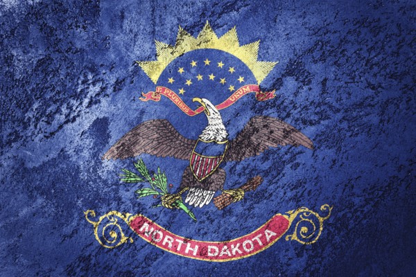 Grunge North Dakota state flag. North Dakota flag background grunge texture