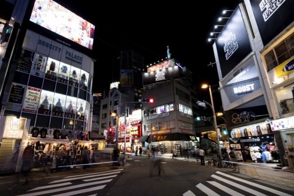 OSAKA, JAPAN - SEPTEMBER 24 2024: The trendy and fashionable Amerikamura district on a clear autumn evening in Osaka, Japan, Asia