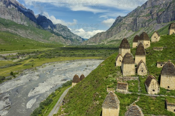 Dead Town Dargavs In North Ossetia. The ancient cemetery of the Alans. Many small stone mausoleums, standing on the side of a mountain