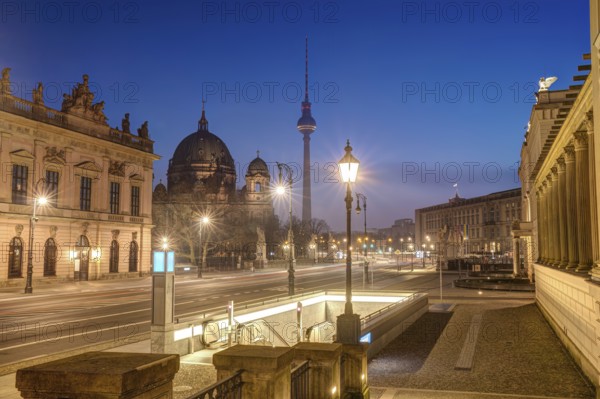 The famous boulevard Unter den Linden in Berlin with the television tower at dusk