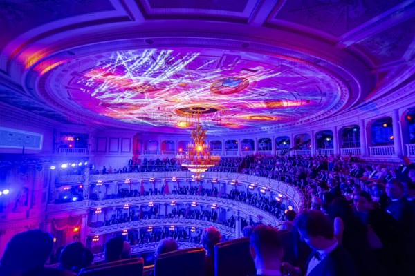 The SemperOperaball 2025 celebrated its 100th anniversary on Friday. Germany's most beautiful classical entertainment event once again proved to be a complete success this year and offered a first-class programme created by top artists. In keeping with tradition, thousands of Dresdeners celebrated the event of the year outside on the theatre square at the Semper Opera Ball. Festively decorated ballroom, Dresden, Saxony, Germany, Europe