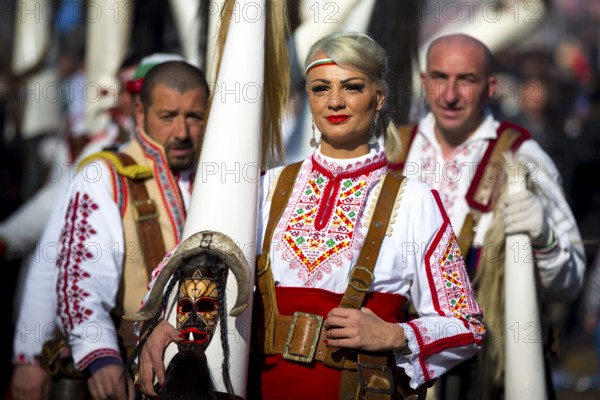 Pernik, Bulgaria - 28 January 2018: Participants take part in the International Festival of Masquerade Games Surva. The festival promotes variations of ancient Bulgarian and foreign customs and masks. Folk costumes