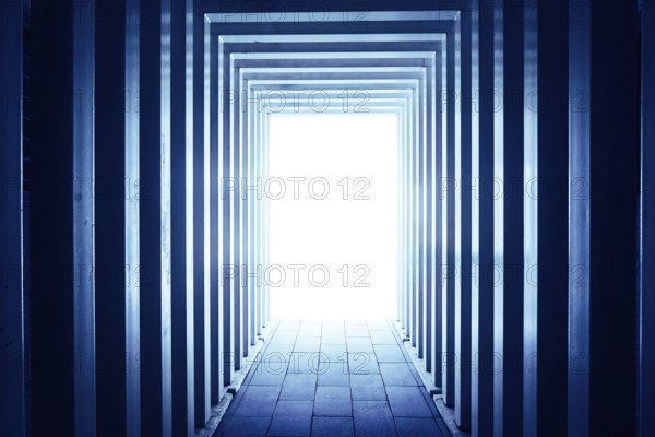 Line-shaped corridors leading to unknown bright exit door