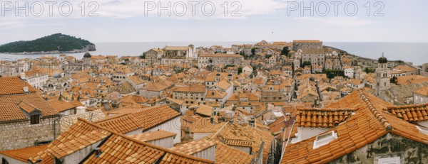 Panoramic views of the entire old town of Dubrovnik. View from the wall to the tiled roofs