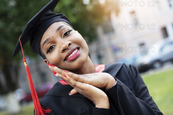 Belarus, the city of Gomil, 01 July 2020. Street in the city. African American in graduation hat, Europe