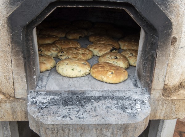 Fresh tasty healthy and delicious homemade olive pies cooked on the traditional clay oven in at a village in Cyprus