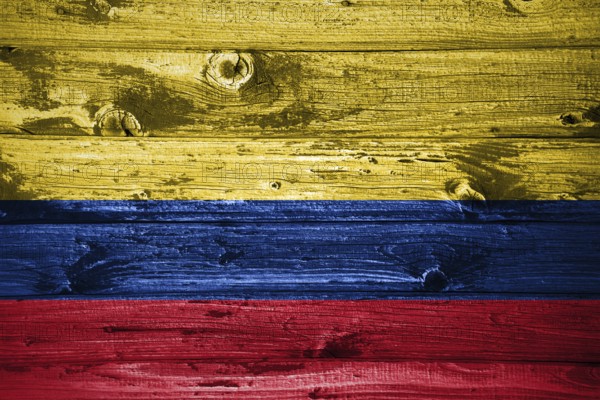 Colombia flag on wooden planks background wood flag