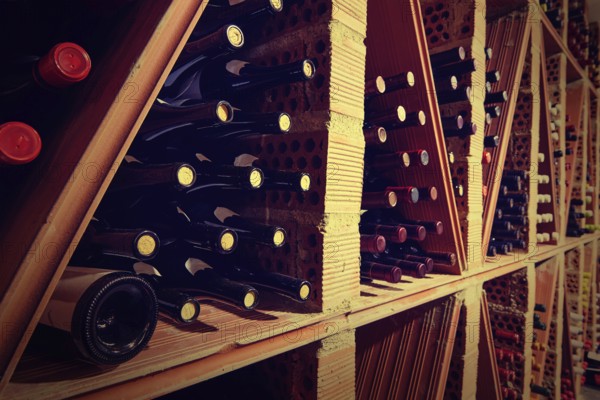 Wine Cellar from Mediterranean with bottles stacked in rows