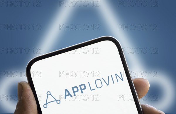 App lovin logo is displayed on smartphone. AppLovin Corporation is an American mobile technology company