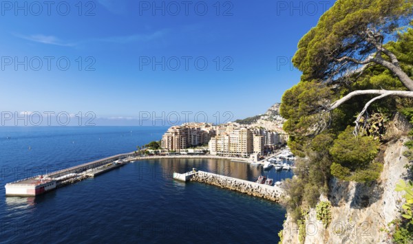 Montecarlo, Monaco, August 2022: panoramic view of the Fontvielle port with blue sky and sea, Europe