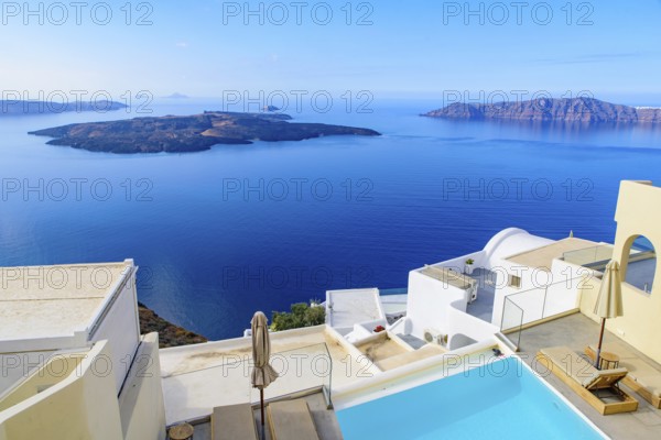 White buildings and hotels with panoramic view of Aegean Sea in Fira, Santorini, Greece, Europe