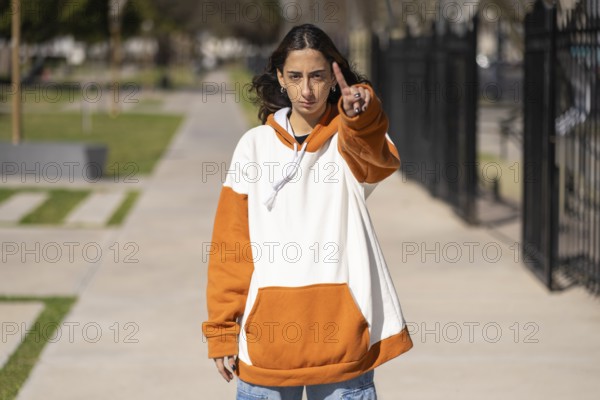 Woman making an objection with her hand