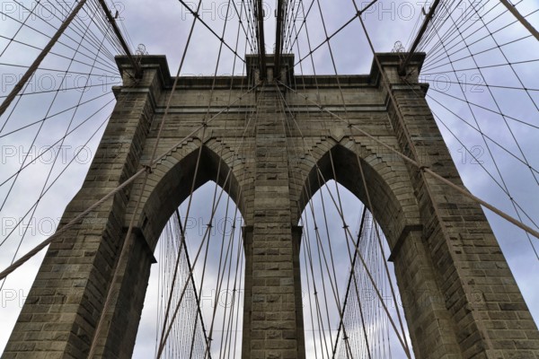 Brooklyn Bridge in Brooklyn, Manhattan, New York, USA United States of America, View of the impressive stone arch and cables of the Brooklyn Bridge, New York City, USA, North America