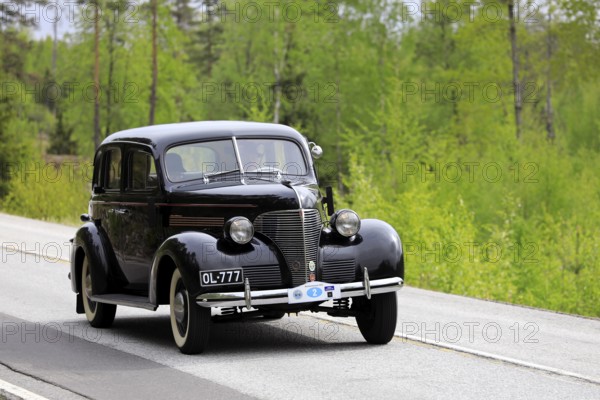 Classic 1930s Chevrolet car on Ascension Day vintage car rally by AHS ry, road 104, Fiskars, Finland. May 26, 2022