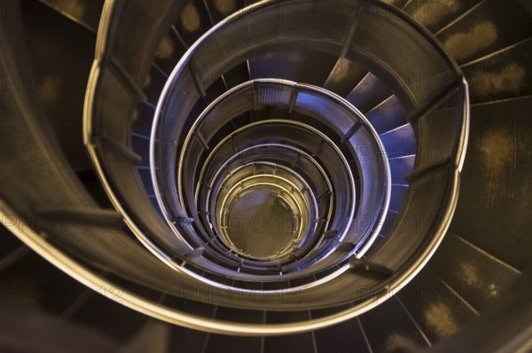 Spiral staircase in an old tower. Dark and gloomy