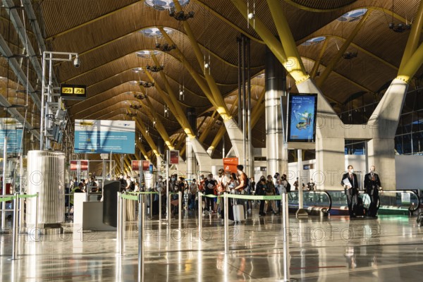 Madrid, Spain, August 2, 2021: Barajas Airport. T4 Terminal. Madrid-Barajas Adolfo Suarez international airport is the main airport of the capital. Interior view of people waiting for boarding, Europe