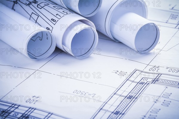 Very close up view on rolled blueprints