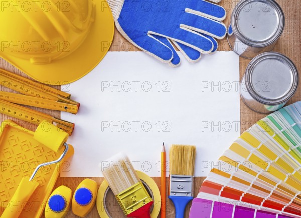 Croup of repair and paint objects on clean sheet of paper construction concept