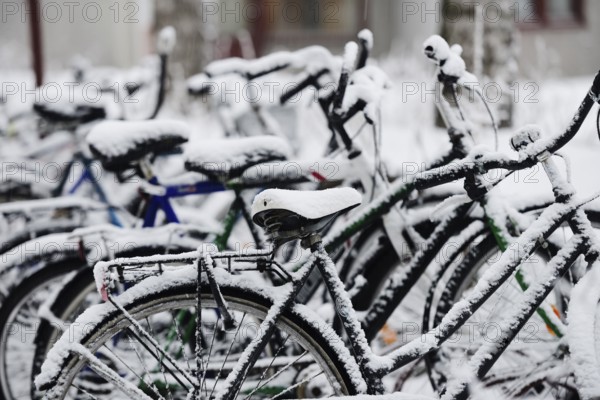 Bikes covered with a blanket of snow, winter in Finland