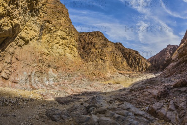 Israel in January. Picturesque and multi-color Black canyon in ancient Eilat mountains