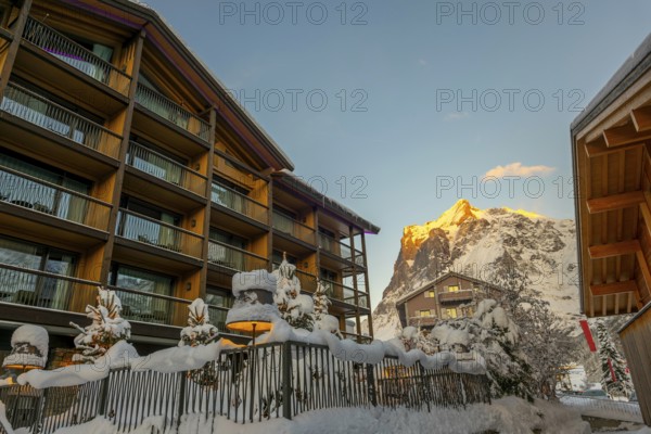 House and Mountain Peak in the Swiss Alps in a Snowy Winter Day in Grindelwald, Canton Bern, Switzerland, Europe
