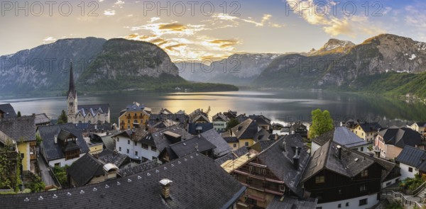 Hallstatt Austria, sunrise panorama nature landscape of Hallstatt village with lake and mountain