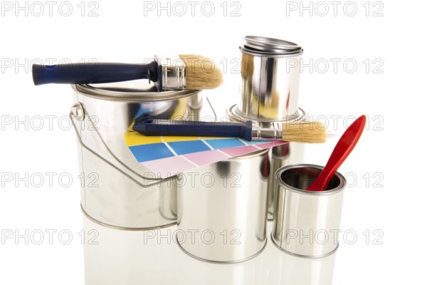 Metal tins for paint with blue brushes isolated over white background