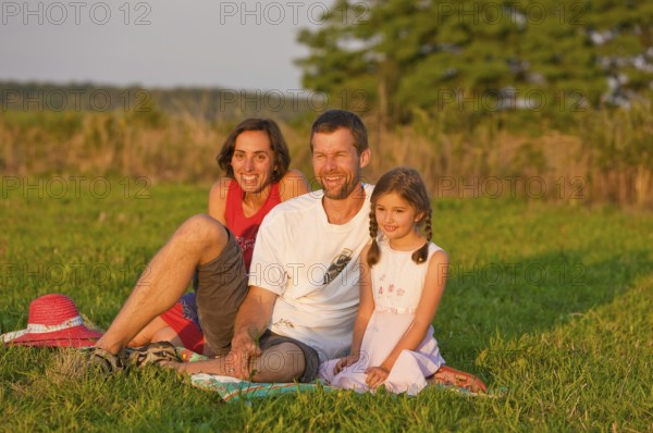 Family on a summer meadow, Altdöbern, Brandenburg, Germany, Europe