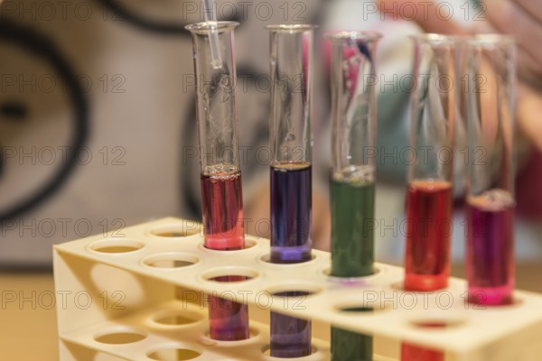 Chemical experiment at school with dye - acid and base reaction