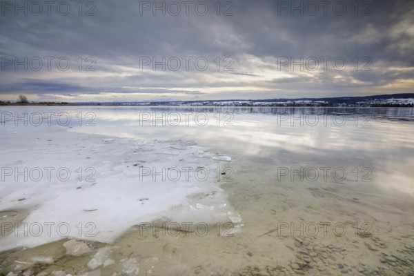 Sea of ice on the lakeshore with bright sky and snowy landscape in the background, campsite, Hegne, Lake Constance, Baden-Württemberg, Germany, Europe