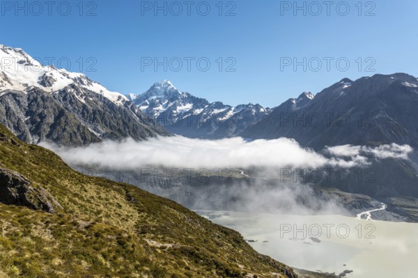 Cloudy view to the valley of Mount Cook National Park from Mueller Hut Route, South Island of New Zealand